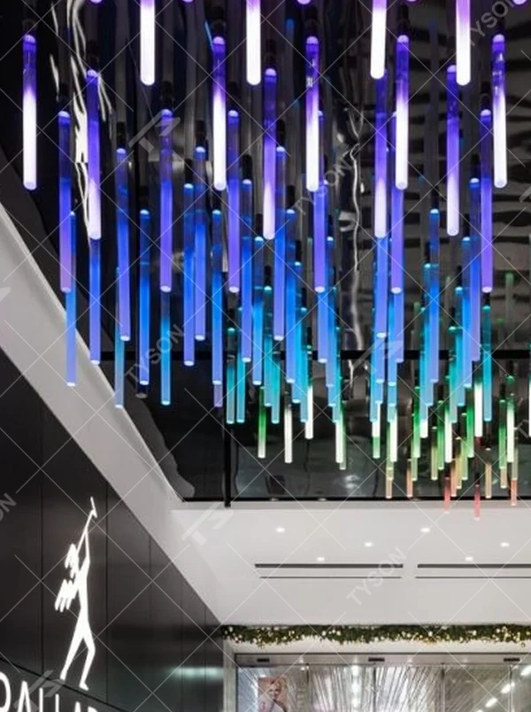 This is an immersive LED pendant light array, composed of densely arranged purple gradient LED light strips arranged vertically, presenting a flowing starry sky effect, with both decorative and atmosphere-creating functions, ideal for trendy commercial spaces such as brand stores and commercial entrances.
