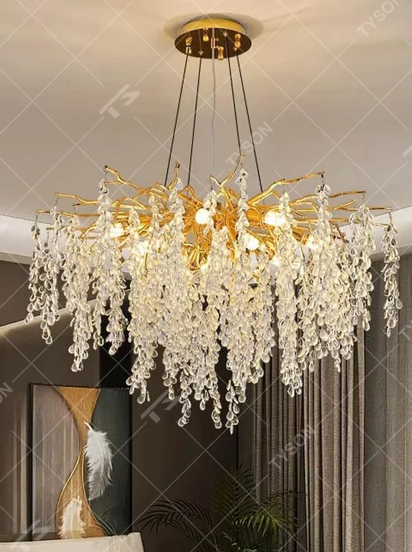 This is a light luxury art-style branch-shaped crystal chandelier, with a gold metal branch frame paired with densely hanging crystal pendants, presenting a dynamic flower cluster blooming effect, with both decorative and lighting functions, ideal for high-end indoor spaces such as living rooms and dining rooms.