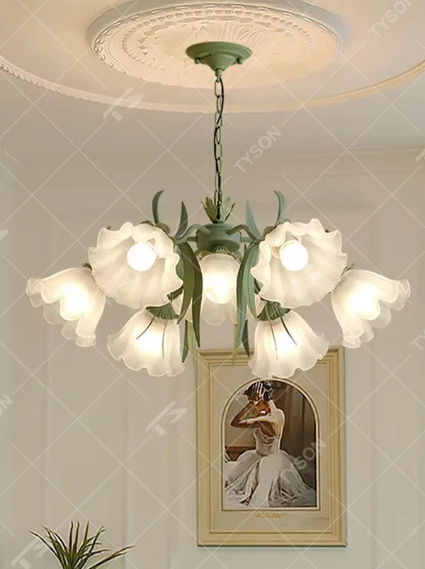 This French pastoral style flower chandelier features a green metal branch paired with white flower-shaped lampshades, with light refracting a soft halo through the frosted lampshades, serving both lighting and decorative purposes, suitable for warm and romantic spaces such as bedrooms and dining rooms.
