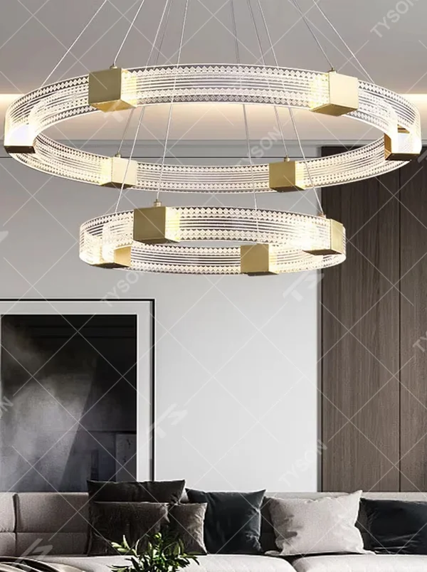 A modern light luxury style double-layer ring chandelier, decorated with gold metal squares and paired with diamond-textured transparent rings. The built-in LED strip emits a soft and brilliant glow when lit, combining decorative appeal with practical illumination, ideal for creating a high-end minimalist space atmosphere.