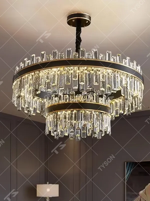 Modern light luxury double-layer ring crystal chandelier, with a golden metal frame and layered transparent crystal strips hanging down, featuring bright and soft light, combining decorative and lighting functions, suitable for living rooms, dining rooms, villas and other light luxury style spaces.

