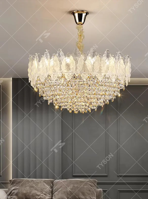 This modern light luxury two-layer flower crown chandelier features an upper lampshade of transparent leaf-textured glass and a lower layer of dense crystal tassels, forming a full flower crown shape. When lit, light refracts through the crystal and glass to emit a brilliant and soft glow, combining an ethereal texture with an ambient atmosphere. Ideal for living rooms, dining rooms, light luxury apartments, and other spaces, it adds a dreamy and exquisite touch to modern minimalist or French light luxury home environments.