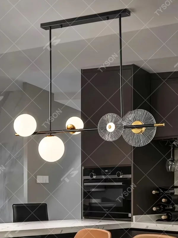 Modern light luxury black and gold combination linear chandelier, featuring a black and gold metal frame paired with milk-white glass balls and radial-patterned glass lampshades. Its minimalist and layered design combines style and ambiance, making it a decorative lighting fixture that elevates the space's aesthetic.