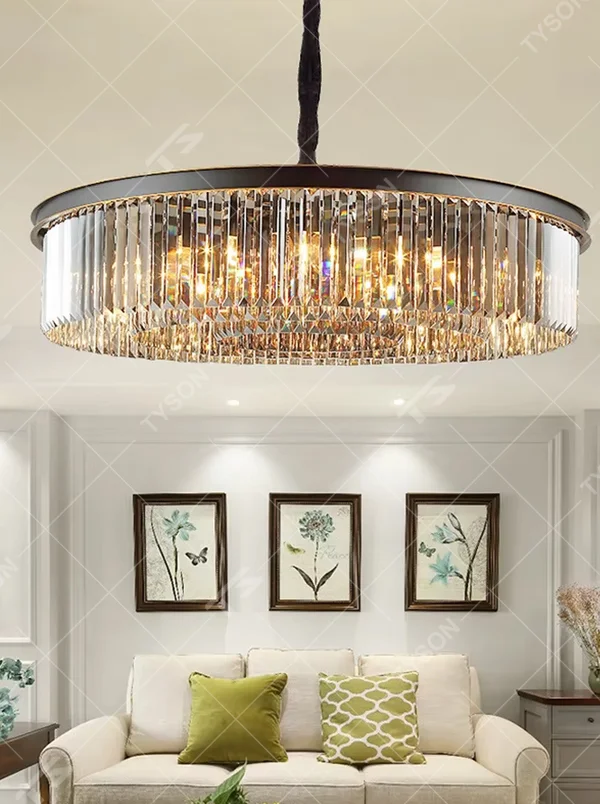 This modern light luxury circular crystal chandelier features a black metal frame, with dense transparent long crystals hanging down to form a full circular shape, suspended by a braided cord. When lit, light refracts through the crystal to emit a brilliant and soft glow, combining a bold texture with an ambient atmosphere. Ideal for living rooms, dining rooms, light luxury apartments, and other spaces, it adds an exquisite and sophisticated touch to modern minimalist or light luxury home environments.