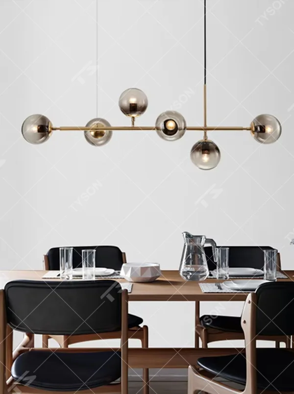 Modern light luxury molecular structure chandelier, featuring a linear brass metal frame paired with gradient smoky gray glass ball lampshades. Its minimalist and layered design combines style and ambiance, making it a decorative lighting fixture that elevates the space's aesthetic.
