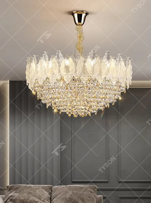This modern light luxury two-layer chandelier features an upper layer of transparent leaf-textured glass lampshades and a lower layer of dense crystal tassels, forming a full flower crown shape. When lit, light refracts through the crystal and glass to emit a brilliant and soft glow, combining an ethereal texture with an ambient atmosphere. Ideal for living rooms, dining rooms, light luxury apartments, and other spaces, it adds a dreamy and exquisite touch to modern minimalist or French light luxury home environments.