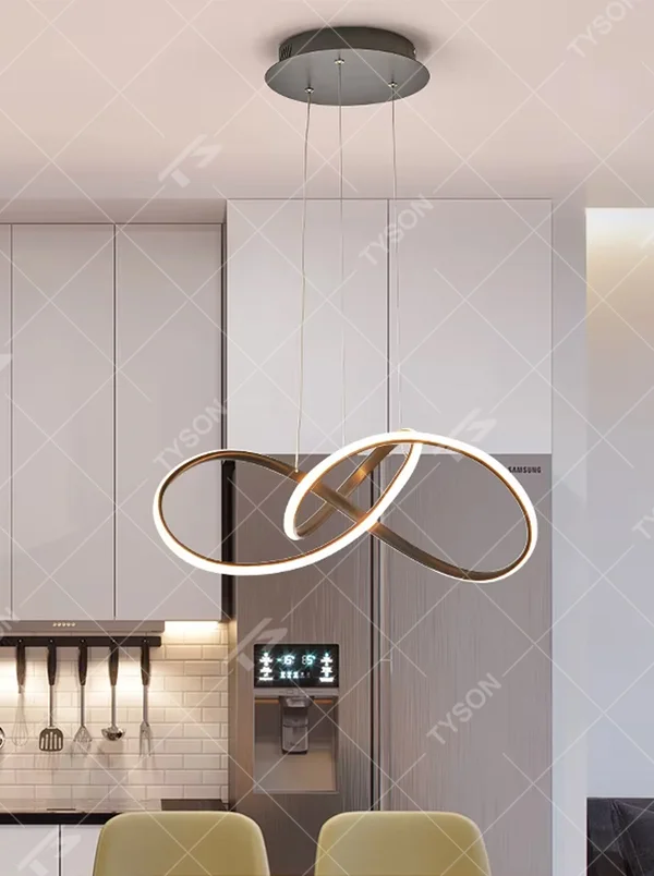 Modern light luxury interlocking double-ring chandelier, featuring a fluid interwoven ring structure in black and gold metal with built-in soft LED lighting. Its dynamic and elegant lines combine style and ambiance, making it a modern home lighting fixture that elevates the space's aesthetic.