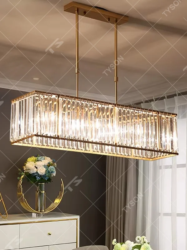 This modern light luxury linear crystal chandelier features a black metal frame, inlaid with transparent long crystals to form a rectangular shape, paired with height-adjustable black suspension wires. When lit, light refracts through the crystal to emit a brilliant and luxurious glow, combining a bold texture with an elegant ambiance. Ideal for dining rooms, bars, light luxury apartments, and other spaces, it adds an exquisite and sophisticated touch to modern minimalist or industrial-style home environments.