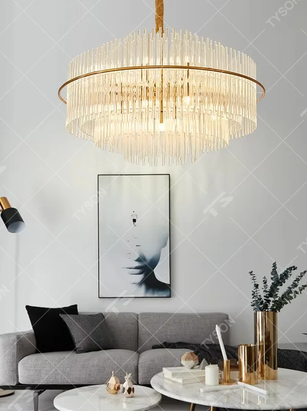This modern light luxury square chandelier features a gold metal frame, with dense transparent glass strips hanging down to form a staggered three-dimensional shape. When lit, light refracts through the glass to emit a soft and even glow, combining a minimalist texture with an ambient atmosphere. Ideal for living rooms, dining rooms, light luxury apartments, and other spaces, it adds an exquisite and sophisticated touch to modern minimalist or Scandinavian-style home environments.