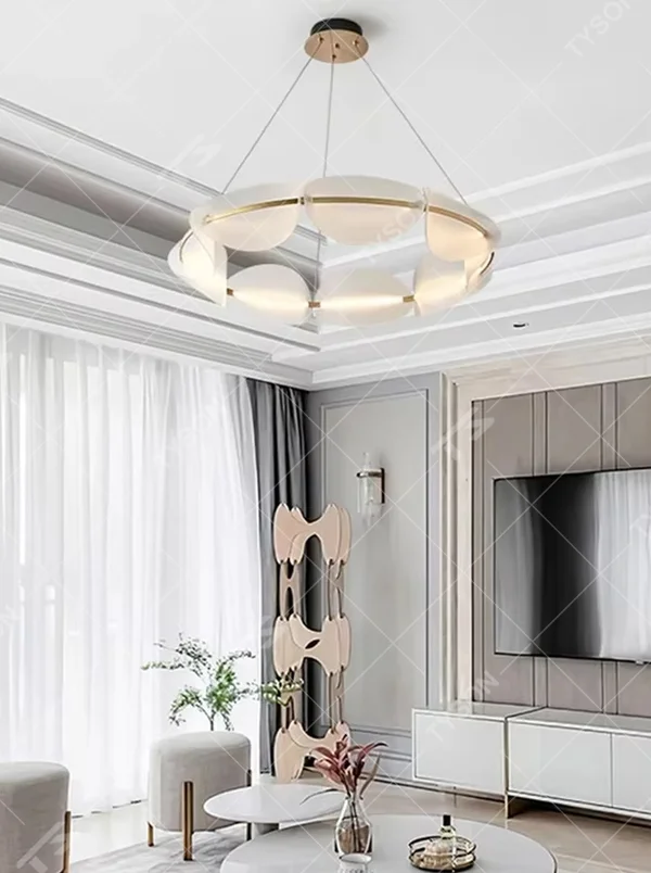 Modern light luxury ring petal chandelier, crafted with frosted acrylic petal-shaped lampshades and accented with gold metal lines. It emits soft and even light, combining artistry and ambiance, making it a decorative lighting fixture that elevates the space's style.