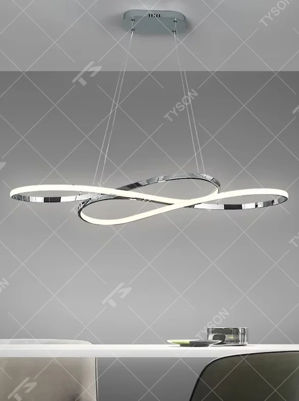 Modern light luxury infinity ring linear chandelier, featuring a fluid interwoven infinity ring structure in polished metal with built-in soft LED lighting. Its dynamic and elegant lines combine a futuristic feel and ambiance, making it a modern home lighting fixture that elevates the space's aesthetic.