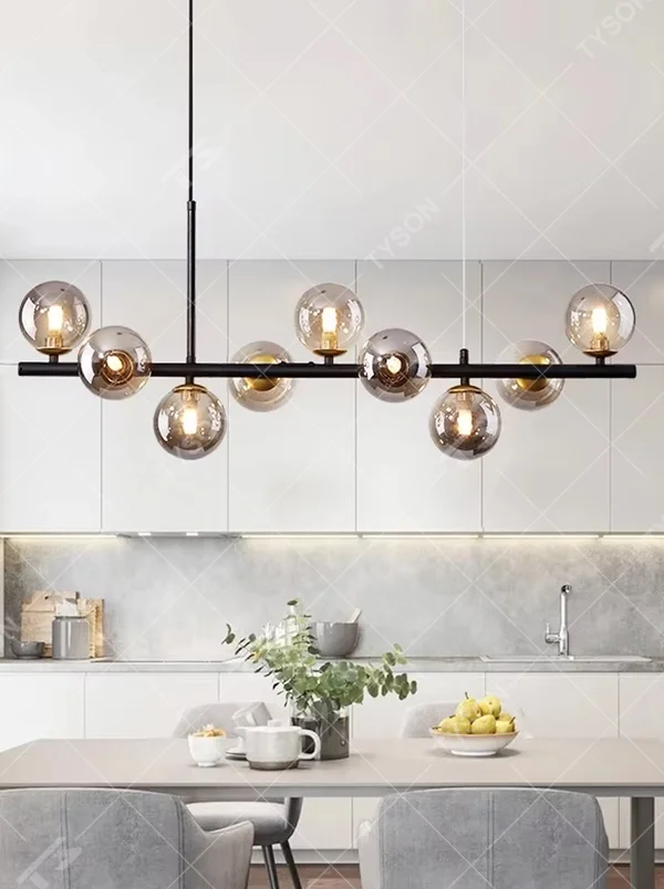 Modern light luxury gradient glass ball linear chandelier, featuring a black metal frame paired with gradient smoky gray glass ball lampshades. Its minimalist and layered design combines style and ambiance, making it a decorative lighting fixture that elevates the space's aesthetic.
