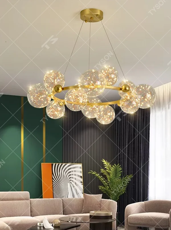 This modern light luxury circular magic bean chandelier features a gold metal ring frame and multiple glass ball lampshades with a starry sky effect inside. When lit, it emits a soft and warm starry glow, combining decorative appeal with an ambient atmosphere. Ideal for living rooms, dining rooms, large apartments, and other spaces, it adds a romantic and exquisite touch to modern light luxury, minimalist, or Nordic-style home environments.