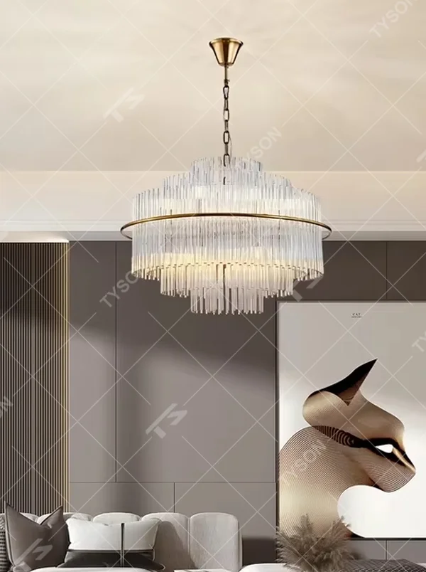 This modern light luxury multi-layer circular crystal chandelier features a gold metal frame, with multiple tiers of transparent long crystals hanging down to form a full circular shape, suspended by a gold chain. When lit, light refracts through the crystal to emit a brilliant and soft glow, combining a luxurious texture with an ambient atmosphere. Ideal for bedrooms, living rooms, light luxury apartments, and other spaces, it adds an exquisite and sophisticated touch to modern minimalist or light luxury home environments.