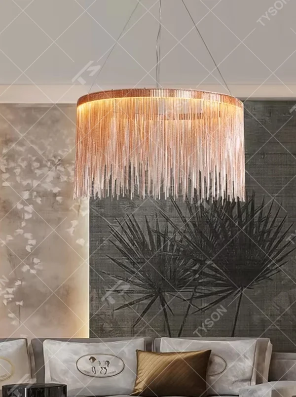 Light luxury metal tassel chandelier, crafted with copper-gold metal strips to create a cascading tassel shape. Light passes through the metal strips to produce a warm, layered lighting effect, making it a high-end decorative lighting fixture that combines artistry and ambiance.
