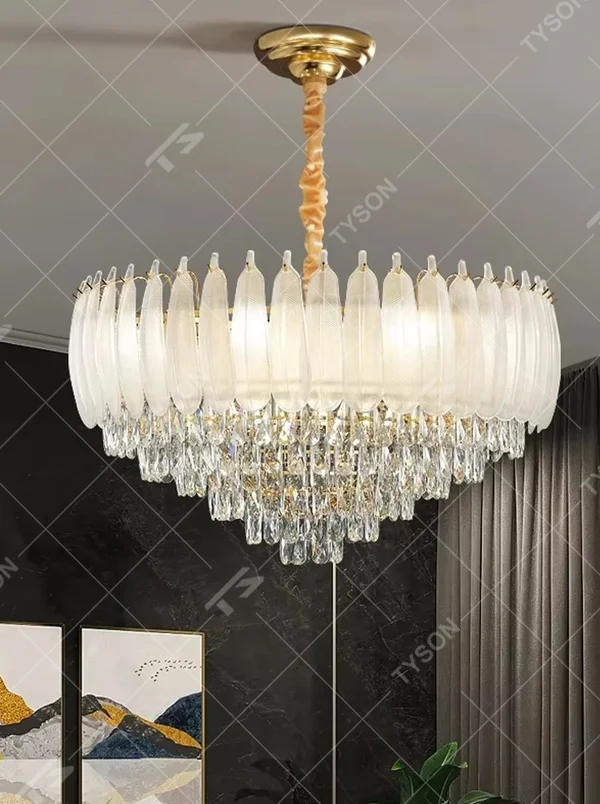 This light luxury retro two-layer chandelier features a dome shape enclosed by vertical-textured frosted glass on the upper layer, paired with hanging crystal tassels on the lower layer, all set in a gold metal frame. When lit, light refracts through the glass and crystal to emit a soft and brilliant glow, combining elegant texture with an ambient atmosphere. Ideal for dining rooms, bedrooms, light luxury living rooms, and other spaces, it adds an elegant and exquisite touch to European retro or modern light luxury home environments.
