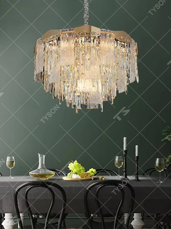 This modern light luxury multi-layer crystal tassel chandelier features a gold metal frame, with multiple layers of transparent long crystal tassels hanging down to form a full square dome shape. When lit, light refracts through the crystal to emit a brilliant and soft glow, combining luxurious texture with an ambient atmosphere. Ideal for dining rooms, living rooms, light luxury apartments, and other spaces, it adds an elegant and exquisite touch to modern minimalist or light luxury home environments.