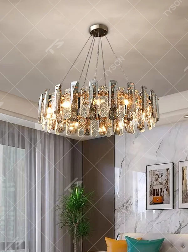 This modern light luxury circular crystal chandelier features a metal frame, inlaid with multi-faceted cut crystal pieces to form a rounded shape. When lit, light refracts through the crystal to emit a brilliant and luxurious glow, combining an exquisite texture with an ambient atmosphere. Ideal for living rooms, dining rooms, light luxury apartments, and other spaces, it adds an exquisite and sophisticated touch to modern minimalist or light luxury home environments.