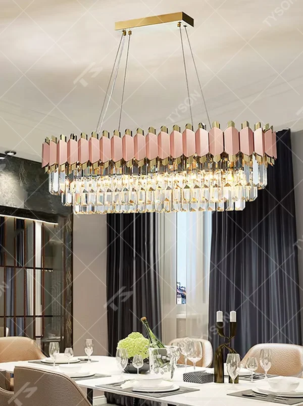This modern light luxury two-layer linear chandelier features an upper frame of pink-and-gold geometric metal pieces, with transparent crystal tassels hanging below, suspended by a gold ceiling base and silver cords. When lit, light refracts through the crystal to emit a brilliant and soft glow, combining a sweet texture with an ambient atmosphere. Ideal for dining rooms, bars, girl-style bedrooms, and other spaces, it adds an exquisite and sophisticated touch to modern minimalist or light luxury sweet home environments.