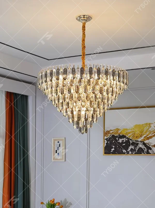 This modern light luxury layered crystal chandelier features a metal ceiling base, with multiple layers of transparent long crystal strips hanging down to form a full fan-shaped dome. When lit, light refracts through the crystal to emit a brilliant and luxurious glow, combining a luxurious texture with an ambient atmosphere. Ideal for living rooms, bedrooms, dining rooms, and other spaces, it adds an elegant and exquisite touch to modern light luxury or European luxury home environments.