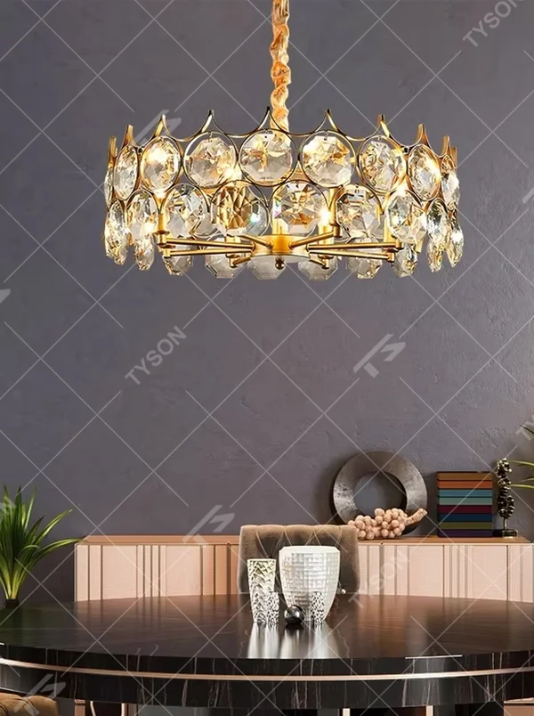 This modern light luxury linear crystal chandelier features a gold metal frame, inlaid with two layers of round-cut crystal slices, suspended by a braided cord. When lit, light refracts through the crystal to emit a brilliant and soft glow, combining a retro-exquisite texture with an ambient atmosphere. Ideal for dining rooms, bars, light luxury apartments, and other spaces, it adds an exquisite and sophisticated touch to modern minimalist or French light luxury home environments.
